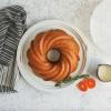 imageNordic Ware Formed Orginal Bundt with Translucent Keeper 12 Cup Golden HourTwilight Blue