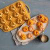 imageNordic Ware 95377 Bundtlette Pan 75th Anniversary Braided Bundt Bites Gold 35