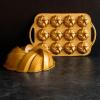 imageNordic Ware NW 95577 75th Anniversary Braided Rope Bundt Cake Pan Gold 12 Cup CapacityPan