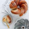imageNordic Ware NW 95577 75th Anniversary Braided Rope Bundt Cake Pan Gold 12 Cup CapacityPan